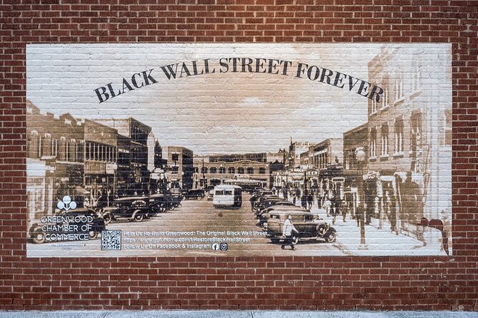Black Wall Street Forever mural on a Greenwood Avenue brick wall, depicting the historic street